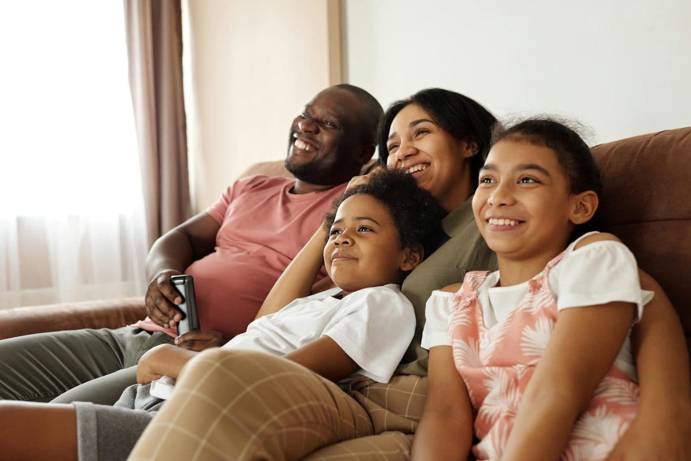 A relaxed, comfortable Tampa Bay family at home after financing their new HVAC system